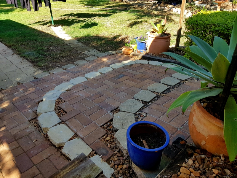 Close up of backyard with bricks and pavers