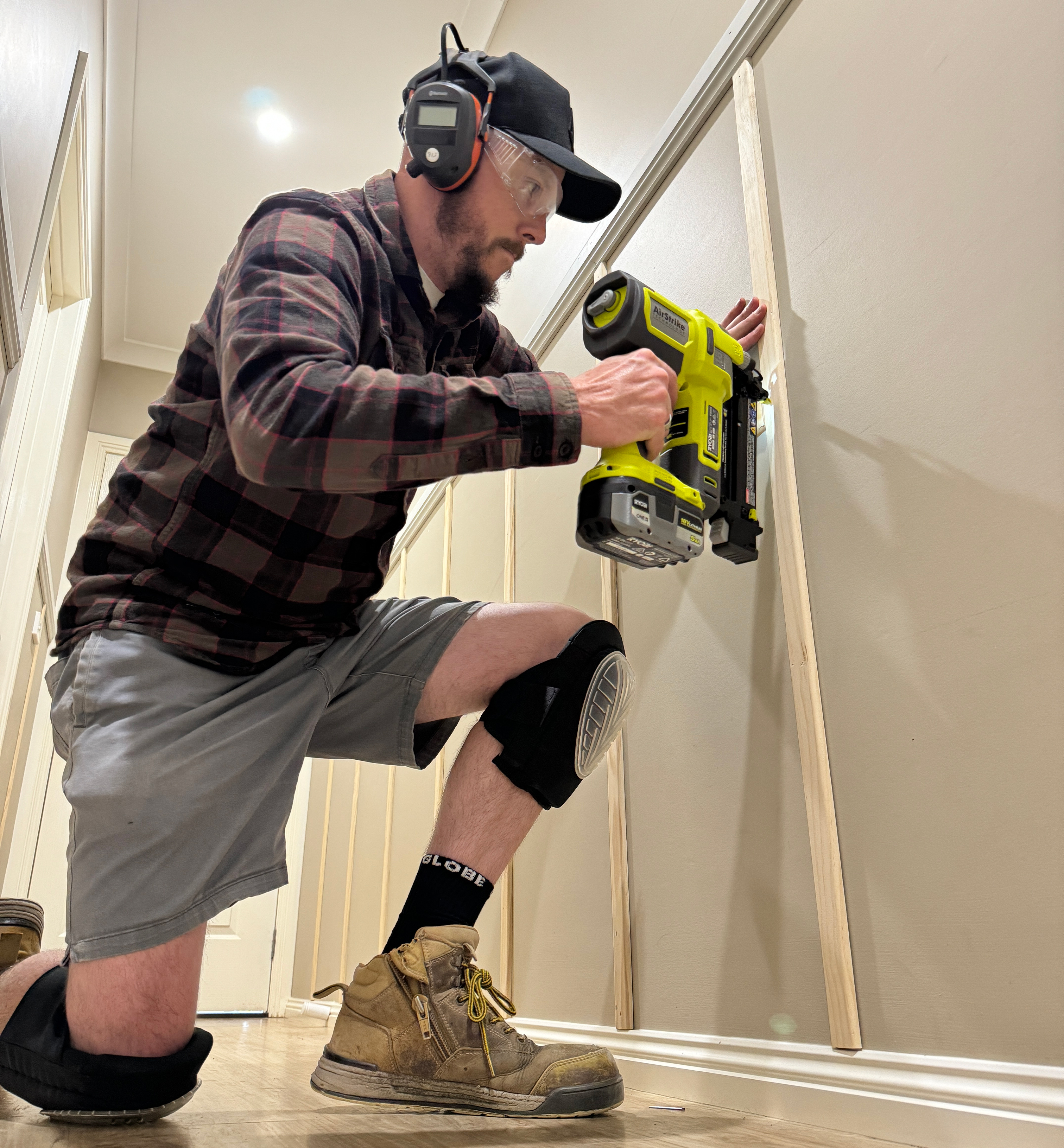 Attached wooden panelling to wall using RYOBI Framing Nailer