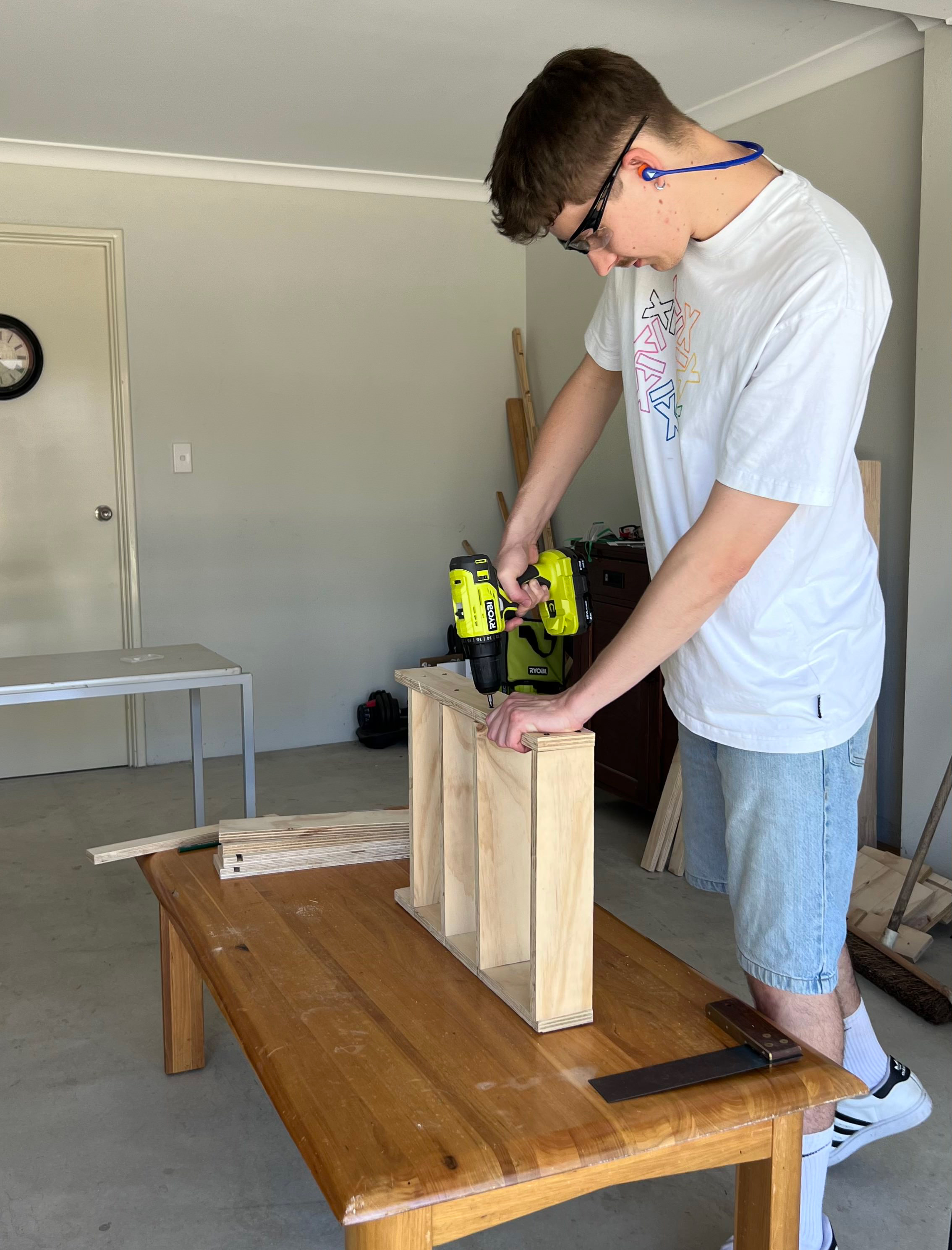 Using a RYOBI Drill Driver to attached shelves to DIY spice rack