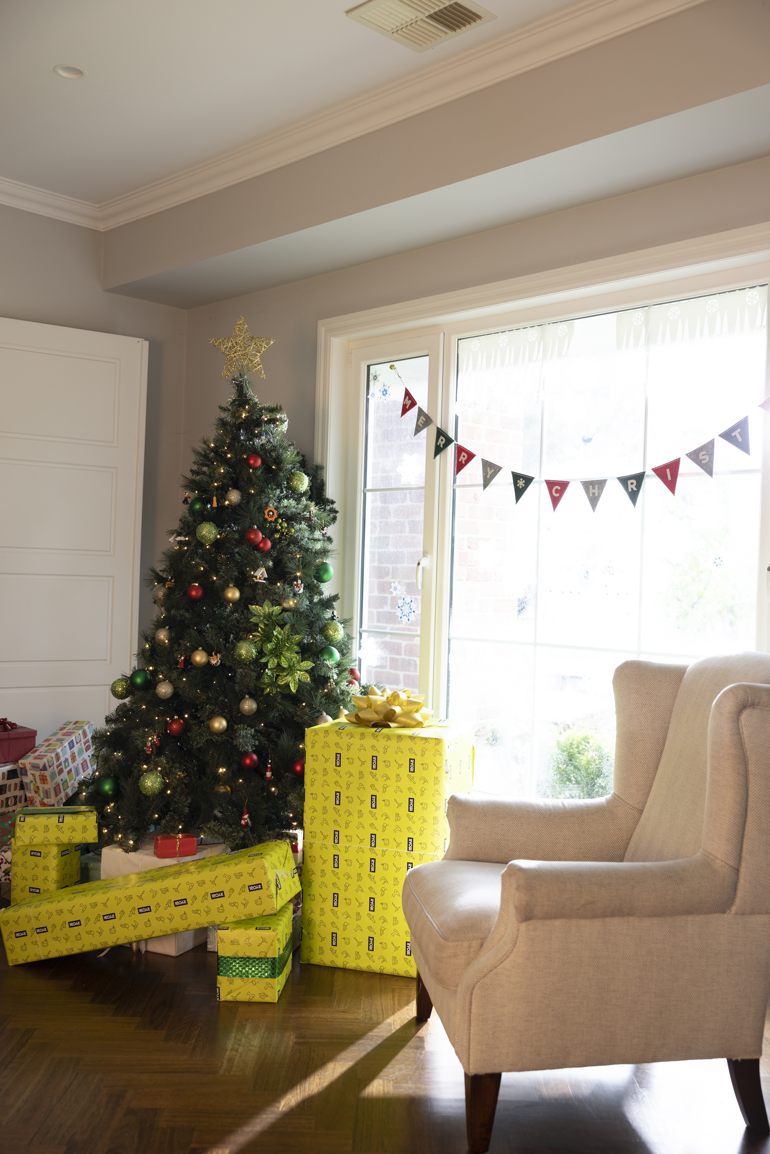 Christmas tree with RYOBI wrapped gifts underneath