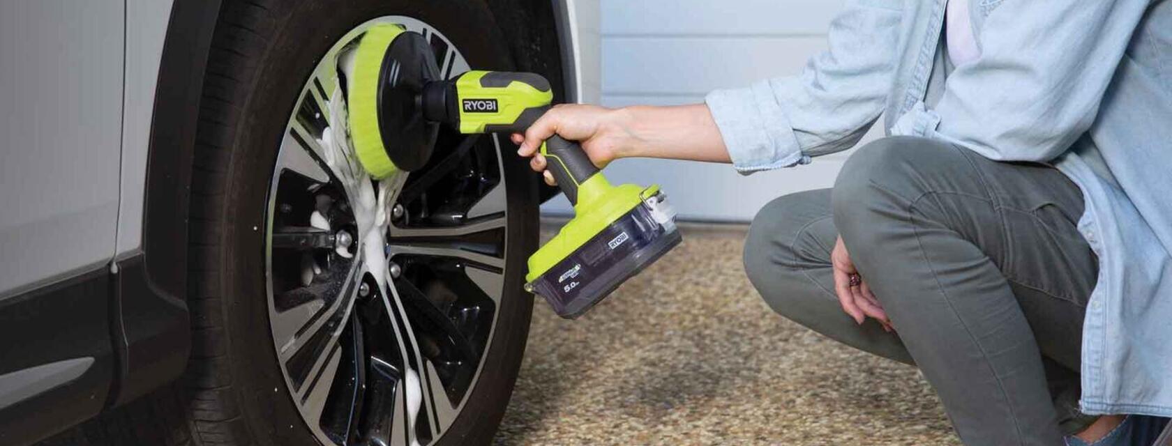 RYOBI Power Scrubber being used to clean car wheels