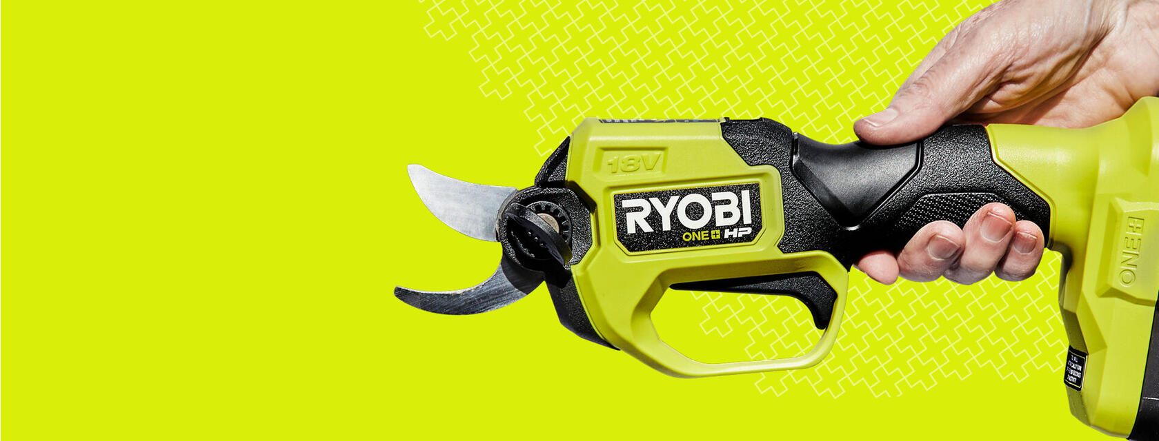 Side on angle of RYOBI secateurs on a hyper green background