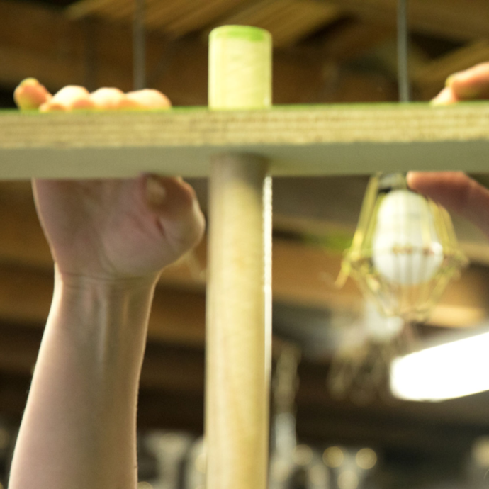 Sliding the tree limbs onto the dowel